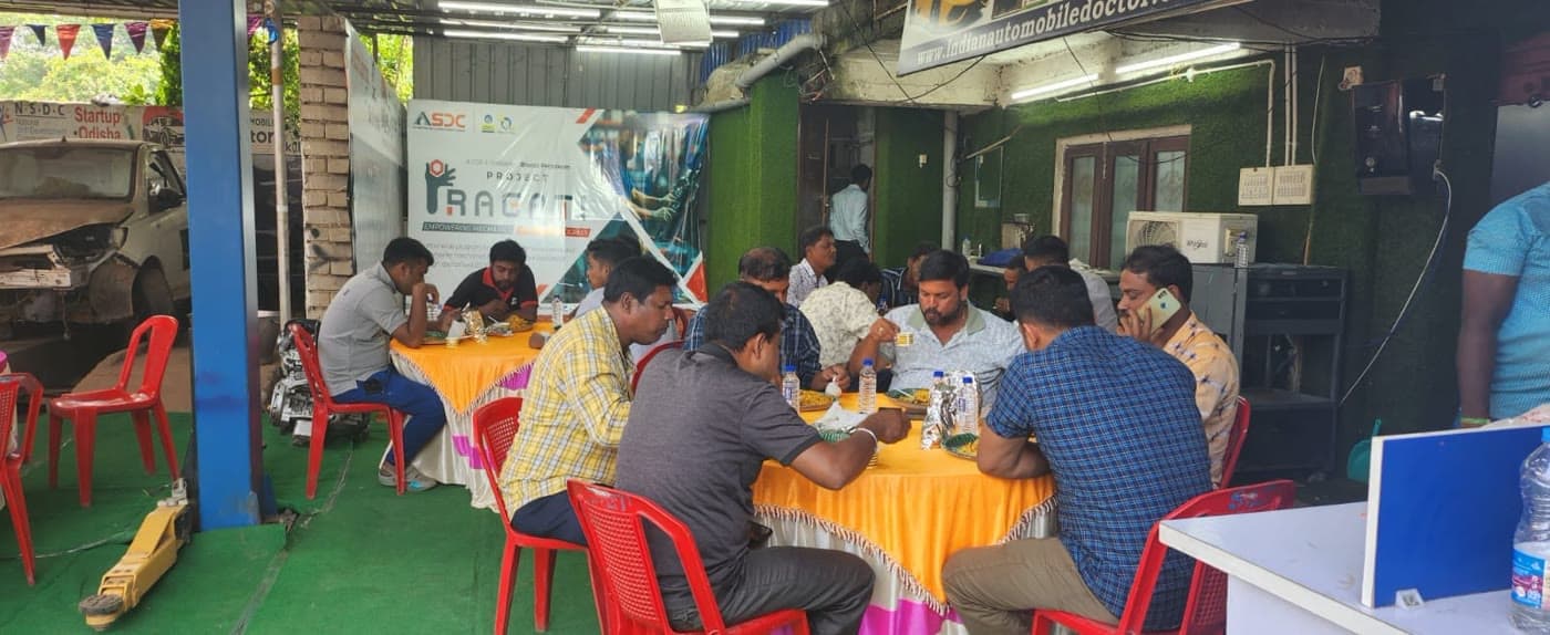 Students working on vehicles during a workshop session