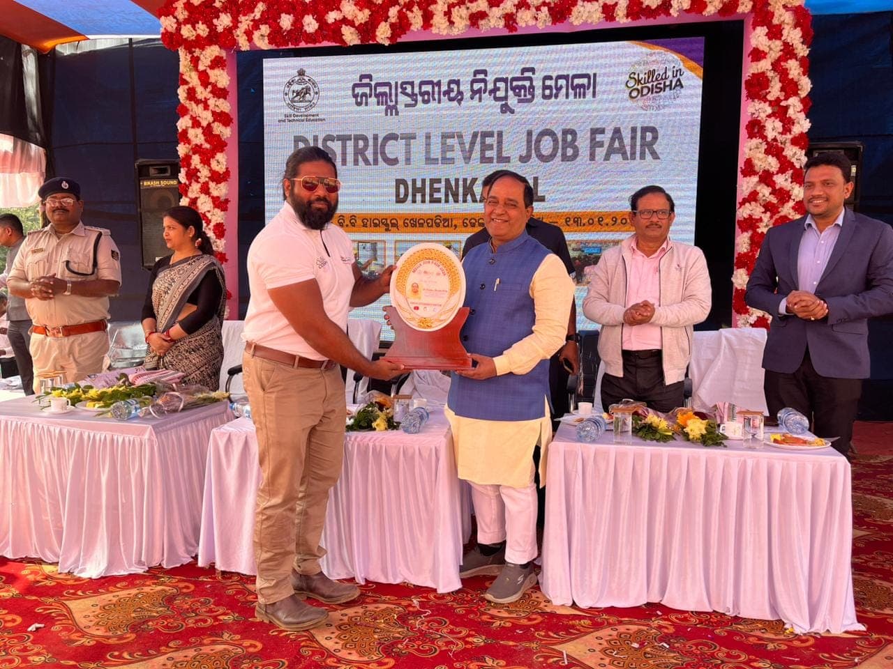 Founder receiving a memento at the District Level Job Fair in Dhenkanal
